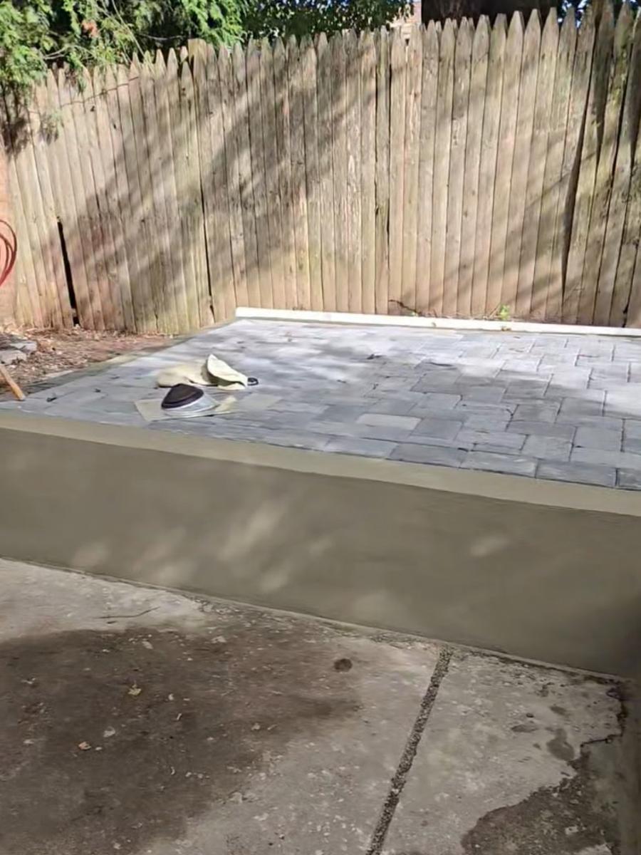 Finished stucco wall and paver patio